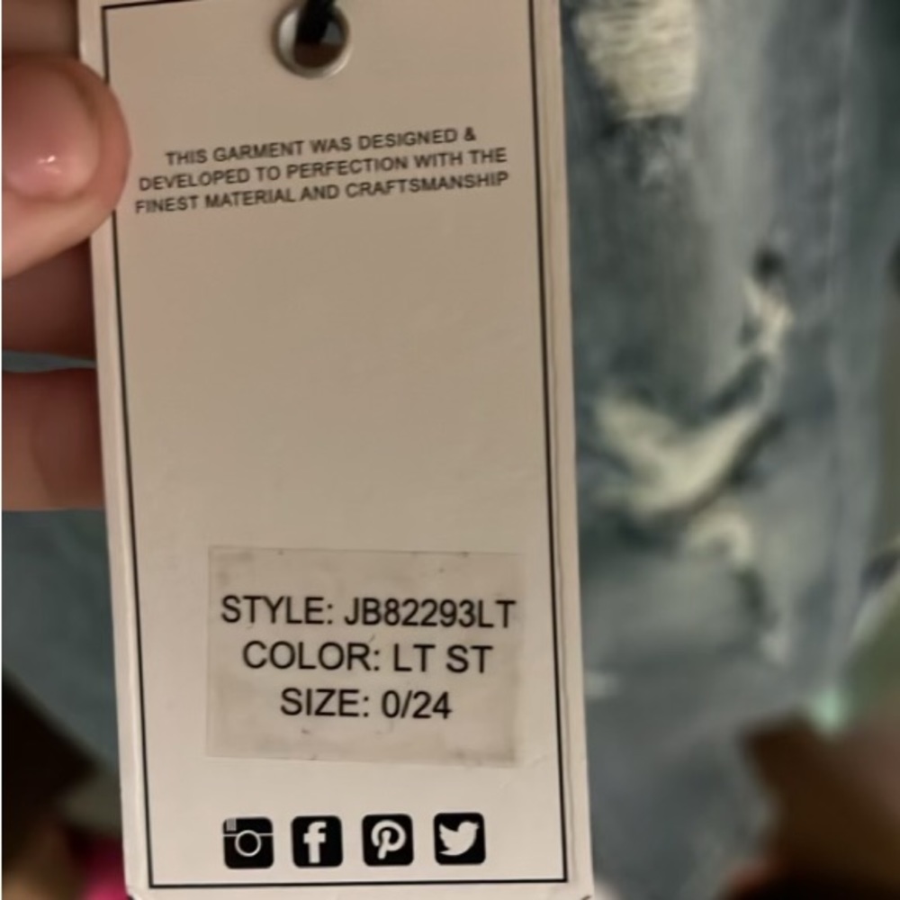 High rise ripped jeans with paint splatter